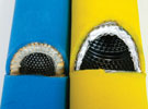 Filter element cross-sections. Blue: A genuine OEM filter element showing the pleated core. Yellow: A poor substitute filter showing a spiral-wound core